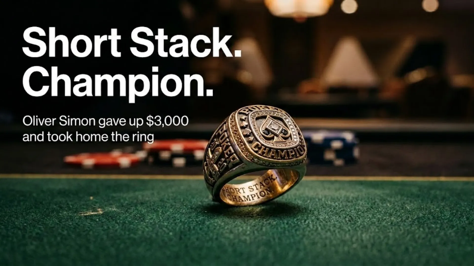 A gold poker championship ring resting on a green felt table with blurred casino chips in the background, representing Oliver Simon's win at the inaugural RGPS Atlantic City Main Event